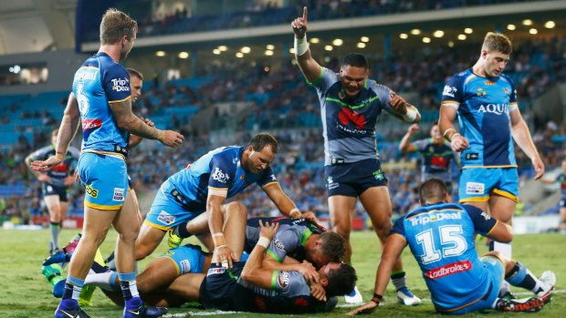 Raiders winger Jordan Rapana scores one of his three tries against the Titans.