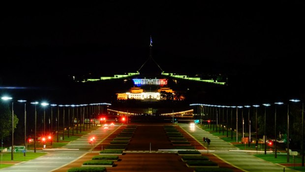 Parliament House lit up in the colours of the French flag after the terrorist attacks in Paris.