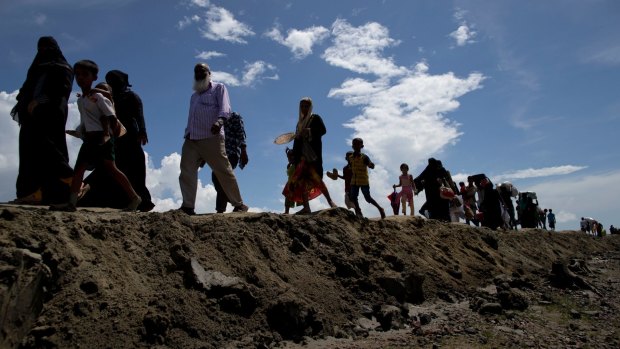 Rohingya Muslims walk from Myanmar to a refugee camp in Teknaf, Bangladesh.