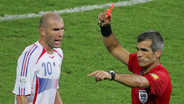 France's Zinedine Zidane is shown a red card by referee Horacio Elizondo in the final's most memorable moment.