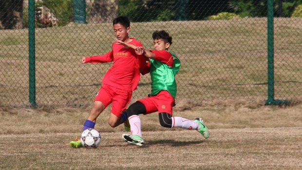 Next generation: Evergrande Football School(ESF) students train to be professional soccer players.