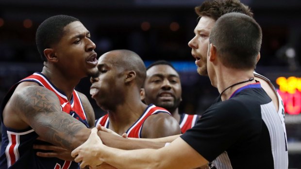 Tempers flare: Washington Wizards guard Bradley Beal and Matthew Dellavedova are separated by referee Kevin Scott after the incident that earned the Australian an ejection.