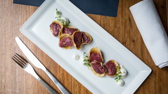 Beetroot ravioli with goat's curd dabs.