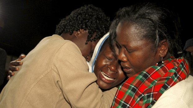 People react after meeting a relative who was rescued after the Garissa University attack.