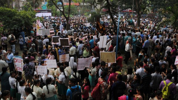 Indian residents and members of the Christian community take part in a vigil and protest against the gang-rape of a 71-year-old nun at a convent-school in Kolkata on Monday. 