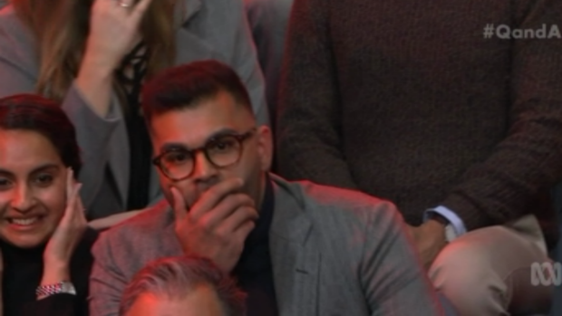 Tarang Chawla listens as Steve Price responds to his question on Q&A.