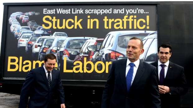 Matthew Guy and Tony Abbott in front of the new mobile billboard blaming Labor for Melbourne's traffic congestion.
