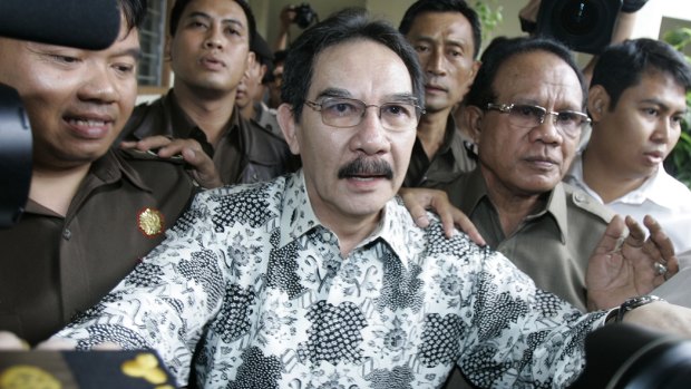 Antasari Azhar, centre, then chief of Indonesia's anti-corruption commission, arrives for his trial at South Jakarta District Court in 2009.