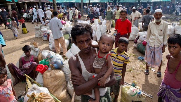 Rohingya Muslims from Myanmar prepare to leave a madrasa that they used as a transit shelter in Bangladesh this week. 