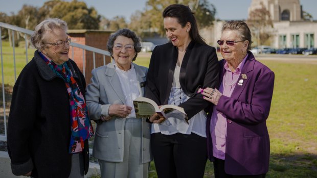 Author Jacqueline Dinan (centre) with her newest book, <i>Between the Dances: World War II Women Tell Their Stories</i>, and with some of the women featured in the book, from left, Thea Commins, Evelyn Booth and Gwen Miles.