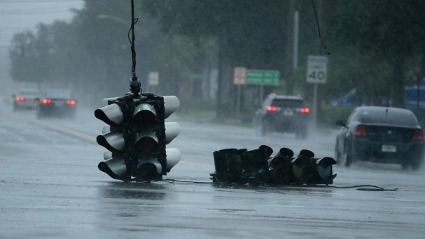 A traffic light hangs in a Jacksonville, Florida, intersection as Hurricane Matthew moves through.