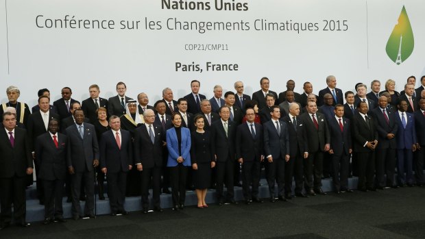 World leaders pose for a group photo at the climate conference on Monday.