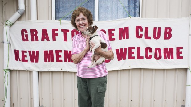 Elaine Broadfoot, secretary of the Grafton Gem Club, with her blind dog Tiny celebrates her club's windfall.