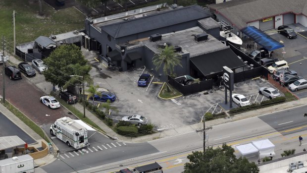 Law enforcement officials work at the Pulse nightclub following the massacre on Sunday.