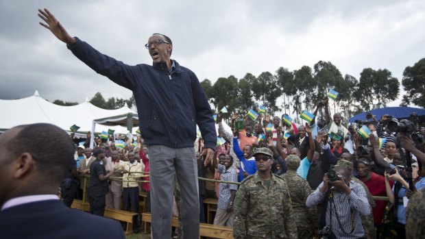 Rwanda's President Paul Kagame waves to a crowd in northern Rwanda in September.