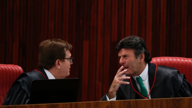 Brazilian Superior Electoral Court Ministers Herman Benjamin, left, and Luiz Fux, right, during the court session in Brasilia on Friday.