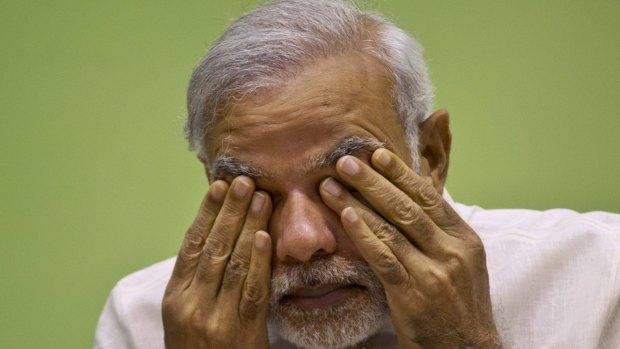 Indian Prime Minister Narendra Modi rubs his eyes as he attends a conference in Delhi earlier this year.