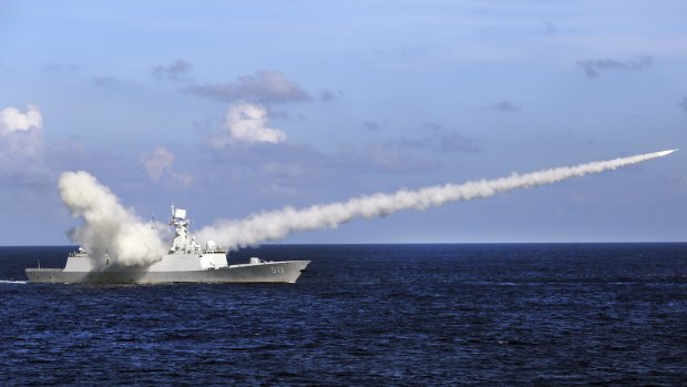 A Chinese missile frigate Yuncheng launches an anti-ship missile during a military exercise in the waters near south China's Hainan Island.