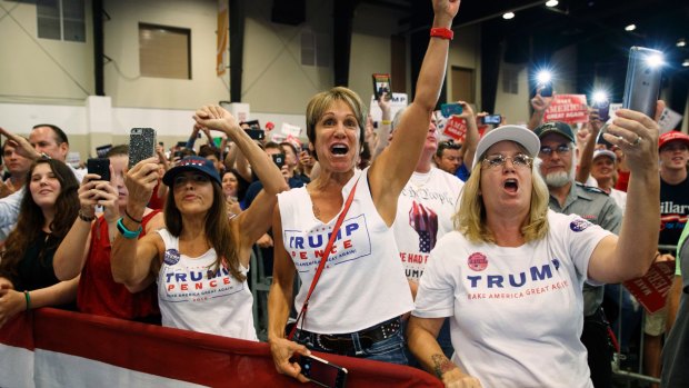 Mad as hell. Supporters of Republican presidential candidate Donald Trump cheer during a campaign rally in Florida.