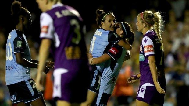 Finals-bound: De Vanna and Chloe Logarzo celebrate after Sydney FC score against Perth Glory at Dorrien Gardens, Perth.