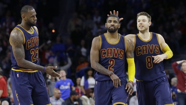 Talented trio: Cleveland Cavaliers guard Kyrie Irving is congratulated by Matthew Dellavedova and LeBron James.