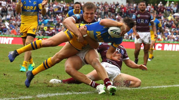 Another home loss: Clint Gutherson crosses for the Eels on a disappointing day for the Manly faithful.