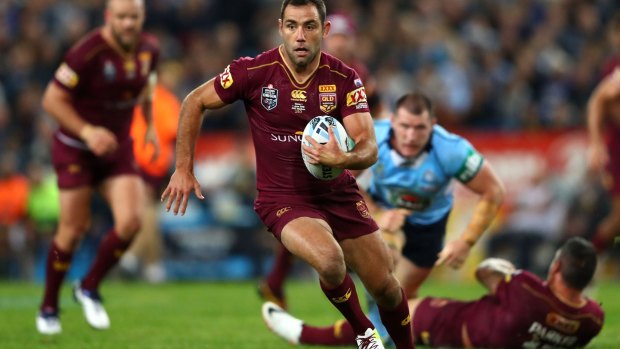 Nothing between them: Cameron Smith finds some open space during Origin I on Wednesday night.