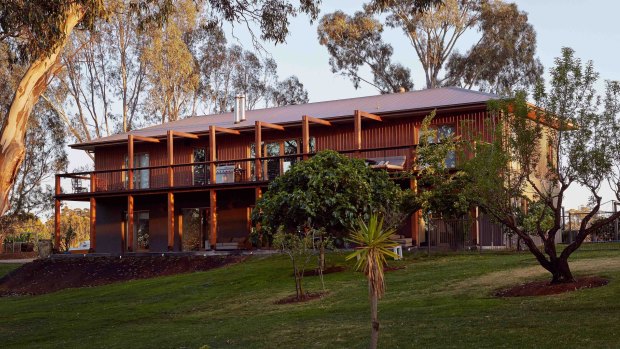 The timber slat exterior at Hide and Seek Winery and Retreat blends with the surrounding gum trees.