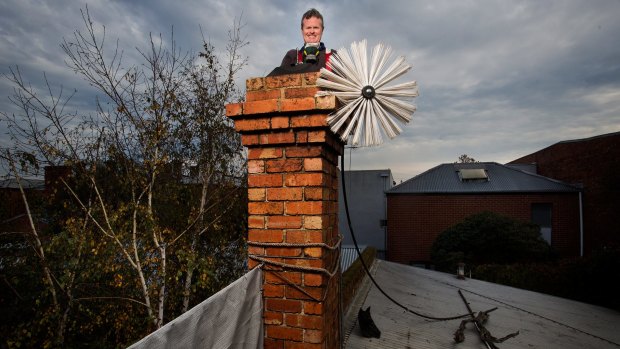 Chimney sweep Dave Dare at work in Clifton Hill. 