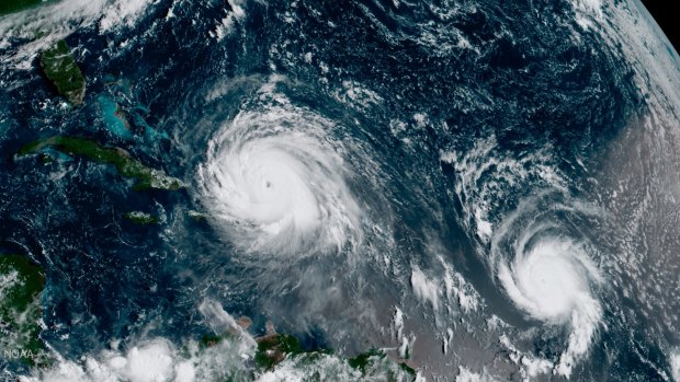 The eye of Hurricane Irma, left, just north of the island of Hispaniola, with Hurricane Jose, right, in the Atlantic Ocean. In a four-week span, hurricanes Harvey, Irma and Maria ravaged Texas, Florida, Puerto Rico and other Caribbean islands last year.