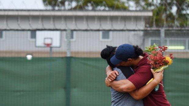 Overjoyed with his HSC results, Leo hugs a family member after the presentation day at Girrakool School at Frank Baxter Juvenile Justice Centre on the Central Coast.
