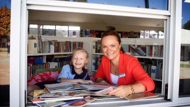 St Joseph's Primary reading recovery teacher Narelle Cartwright with a pupil.
