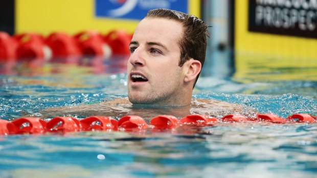 Back on top: James Magnussen celebrates winning the men's 50m freestyle final on Thursday night.