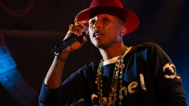 Not happy: US singer Pharrell Williams has criticised Iranian authorities for punishing some of his fans in the Islamic state.