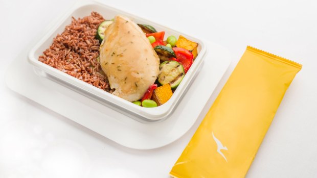 Chicken with red rice, roasted Mediterranean vegetables, soya beans and thyme jus served in economy and premium economy.