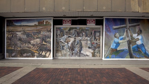 Murals are painted on abandoned building on lower Dexter Avenue in Montgomery, Alabama.