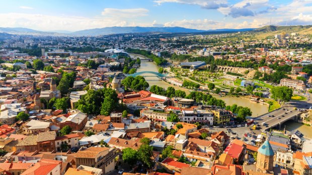 Squished between Europe and Asia, the Georgian capital of Tbilisi is a city in bloom, set in a dramatic valley through which the Mtkvari river flows. 