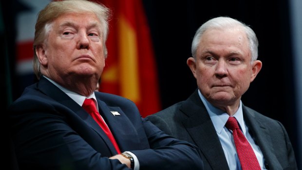 US President Donald Trump sits with Attorney-General Jeff Sessions during the FBI National Academy graduation ceremony in last month.