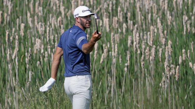 Dustin Johnson finds the going tough during his practice round prior to the 2017 US Open.