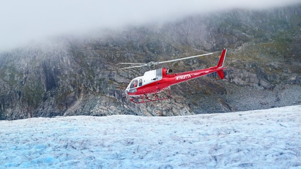 A helicopter landing on Mendenhall Glacier.