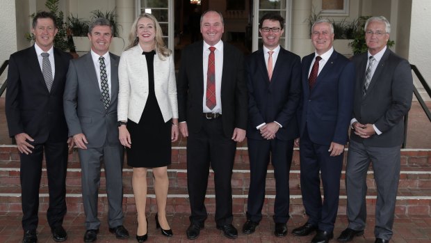 Nationals MPs in the ministry pose with leader Barnaby Joyce (centre) after Wednesday's swearing-in ceremony at Government House.