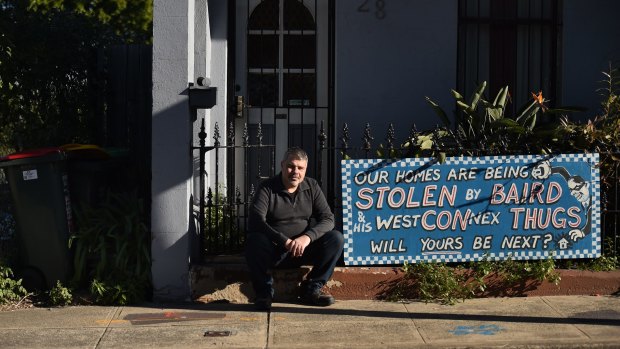 Disgruntled owner Richard Capuano with a protest sign outside his St Peters home. 