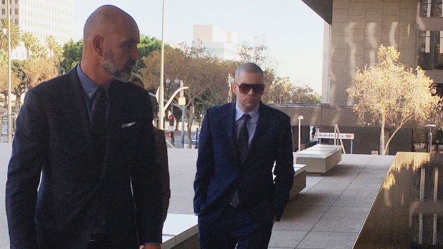 Former Glee actor Mark Salling, right, arrives at federal court in Los Angeles on December 18, 2017. Salling has pleaded guilty to possession of child pornography.