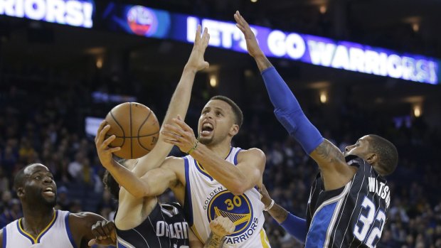 Hard work: Stephen Curry and the Golden State Warriors had to earn their NBA-record 45th consecutive home win.