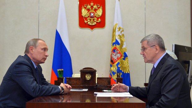Russian President Vladimir Putin, left, meets with Russia's Prosecutor General Yuri Chaika.
