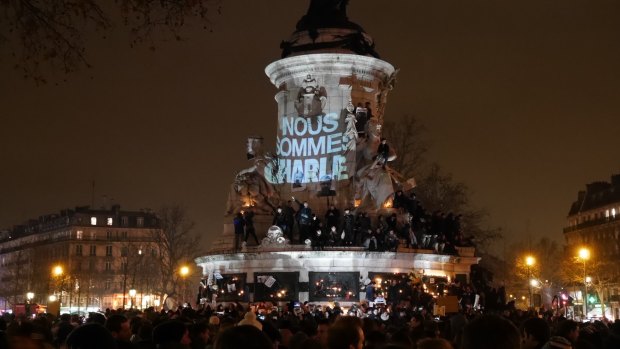 Crowds gather at the Place de la Republique in Paris to protest against the killing of <i>Charlie Hebdo</i> magazine staff by terrorist gunmen.