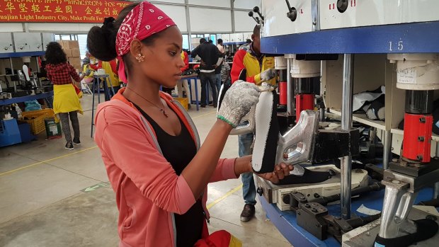 A factory worker make shoes at the Chinese company Huajian's plant in Addis Ababa, Ethiopia. Huajian produces some Ivanka Trump products. Huajian workers in China say they face long hours, low pay and verbal abuse. Huajian has been moving some of its production to Ethiopia, where labour costs are even lower.