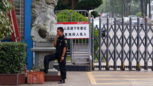 A security guard at the Ganzhou Huajian International Shoe City Co, which has been used by Ivanka Trump's brand.