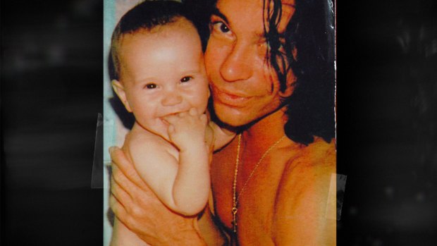 Michael Hutchence with his baby girl Heavenly Hiraani Tiger Lily.