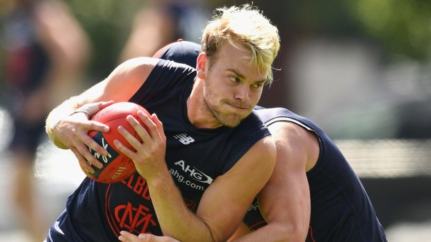 Jack Watts is tackled by Angus Brayshaw during a Melbourne training session last week. 
